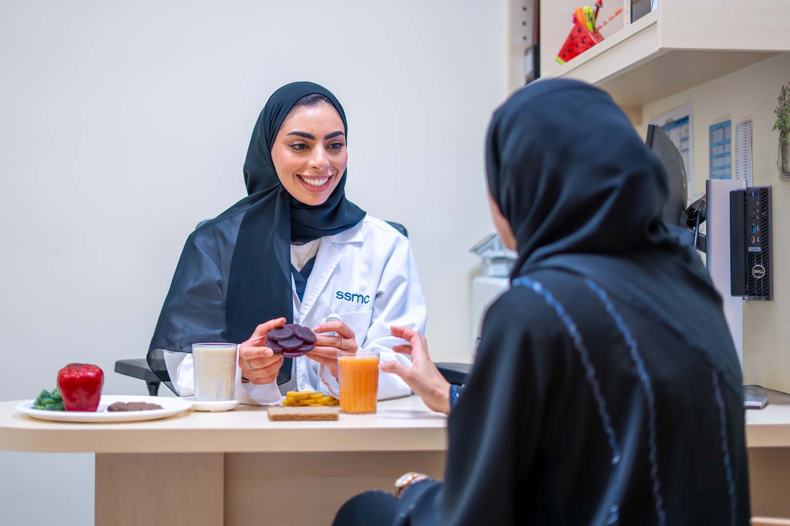 Clinical Nutritionist working at a computer
