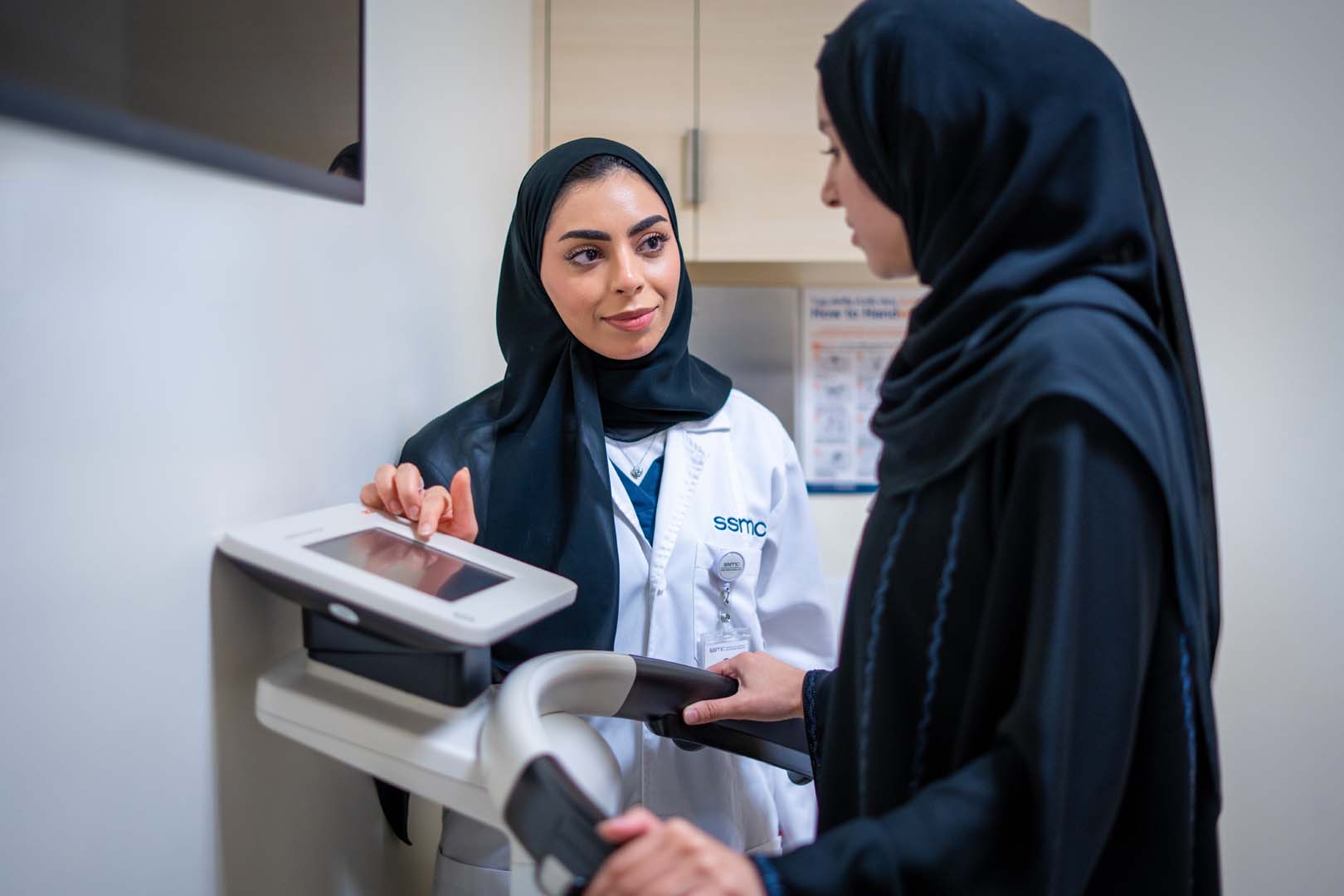 Dietitian educating patient using a body diagram