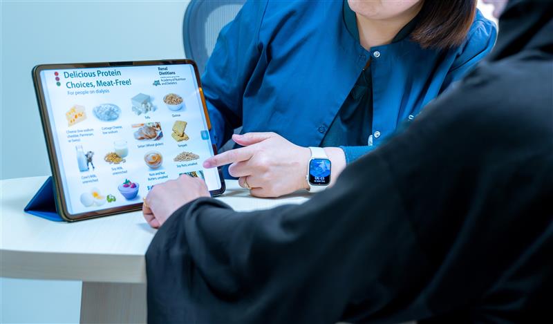 Dietitian reviewing data on a tablet